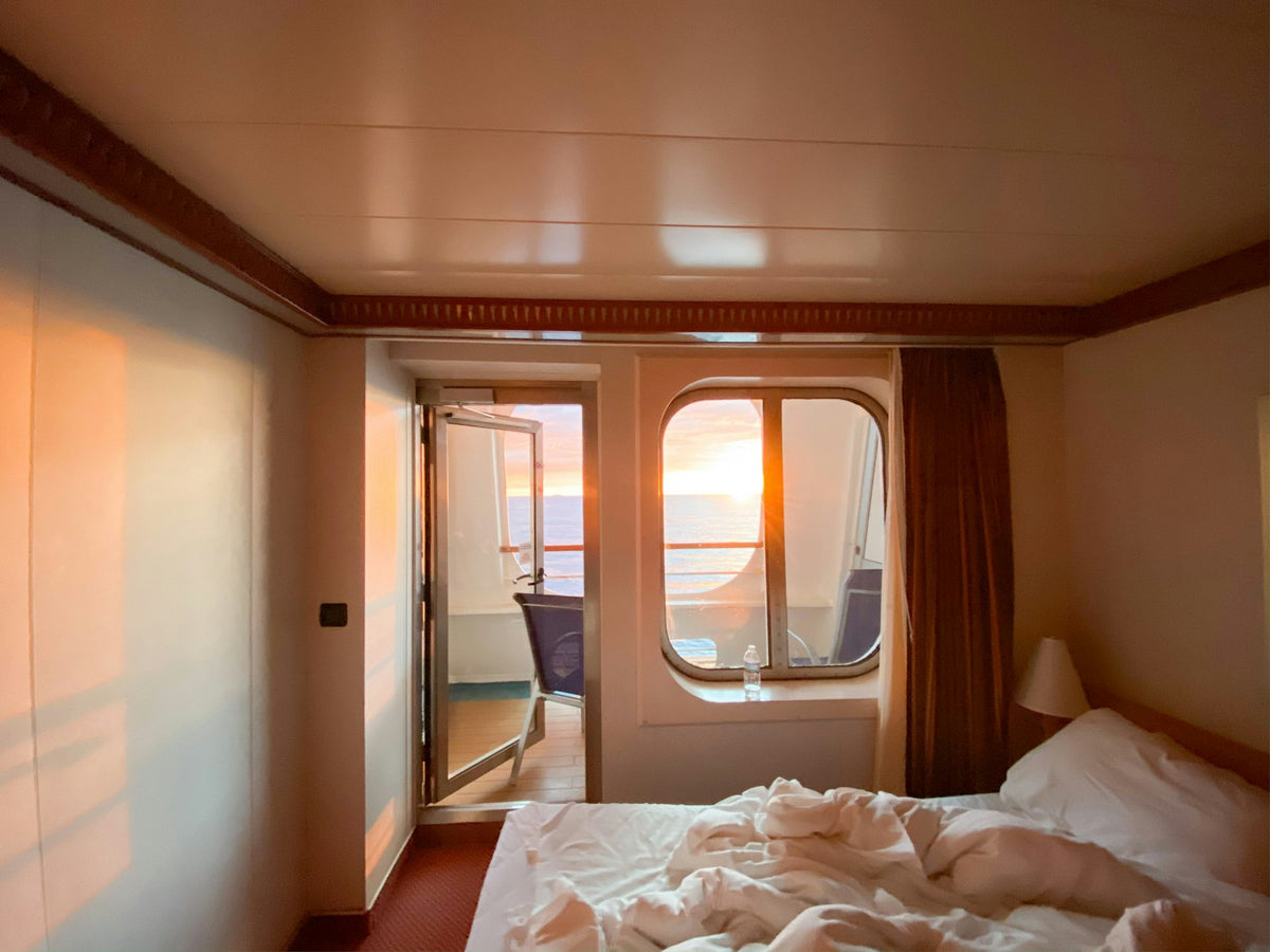 Made-up berth beside a cabin window