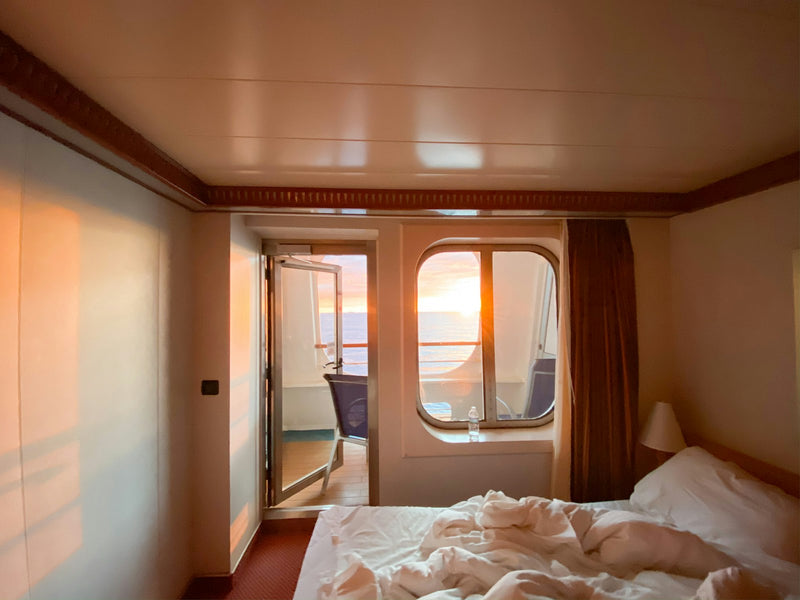 Made-up berth beside a cabin window