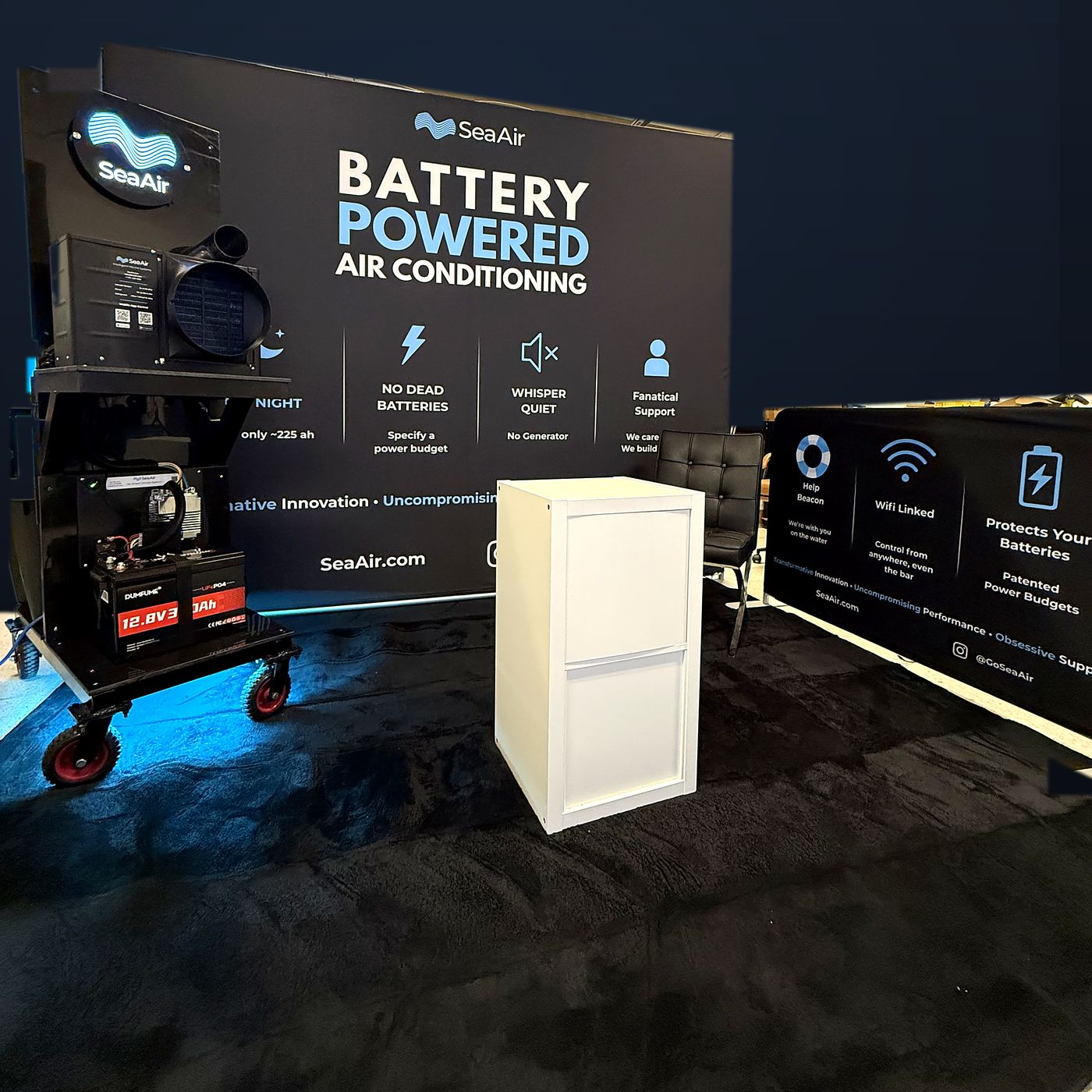 The SeaAir boat show booth: backdrop and demo unit on a 12V battery cart