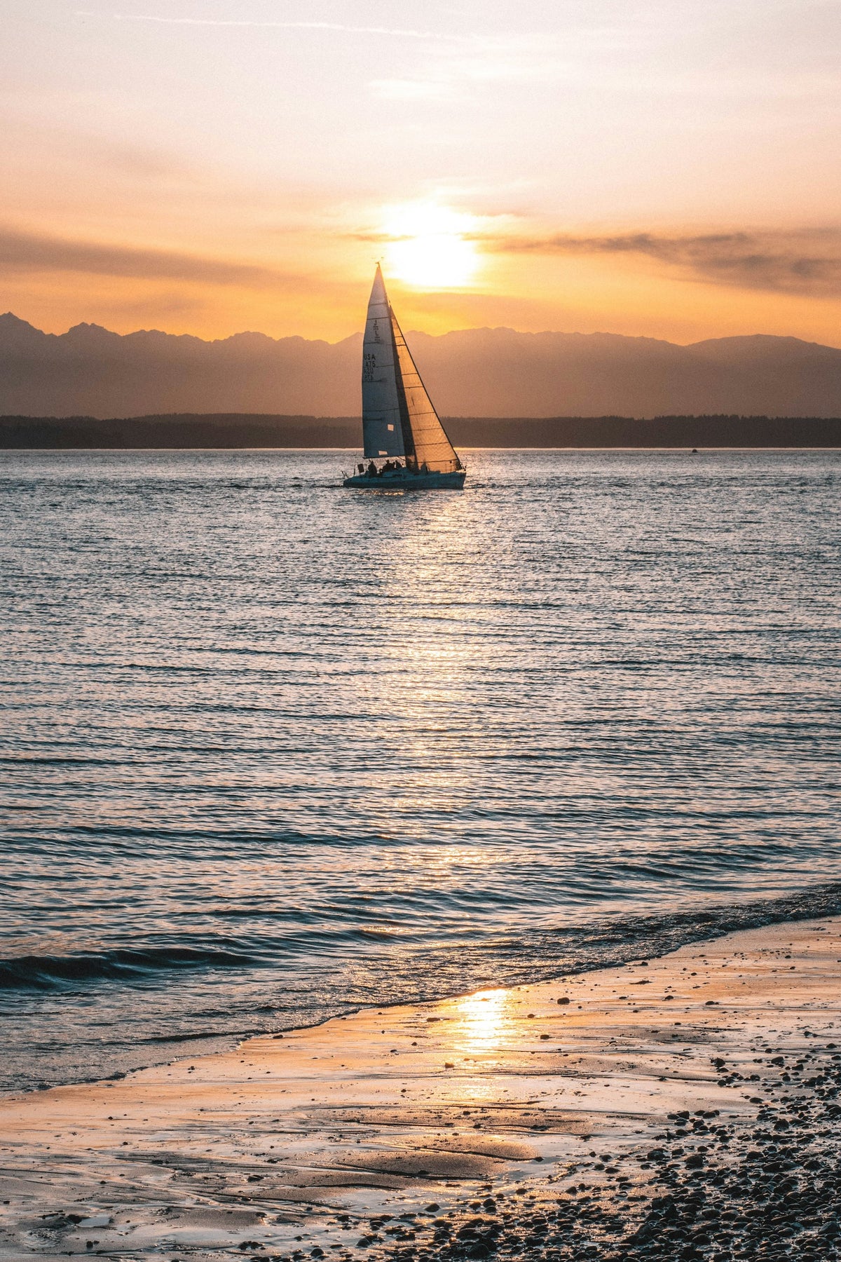 Sailboat at anchor at sunset